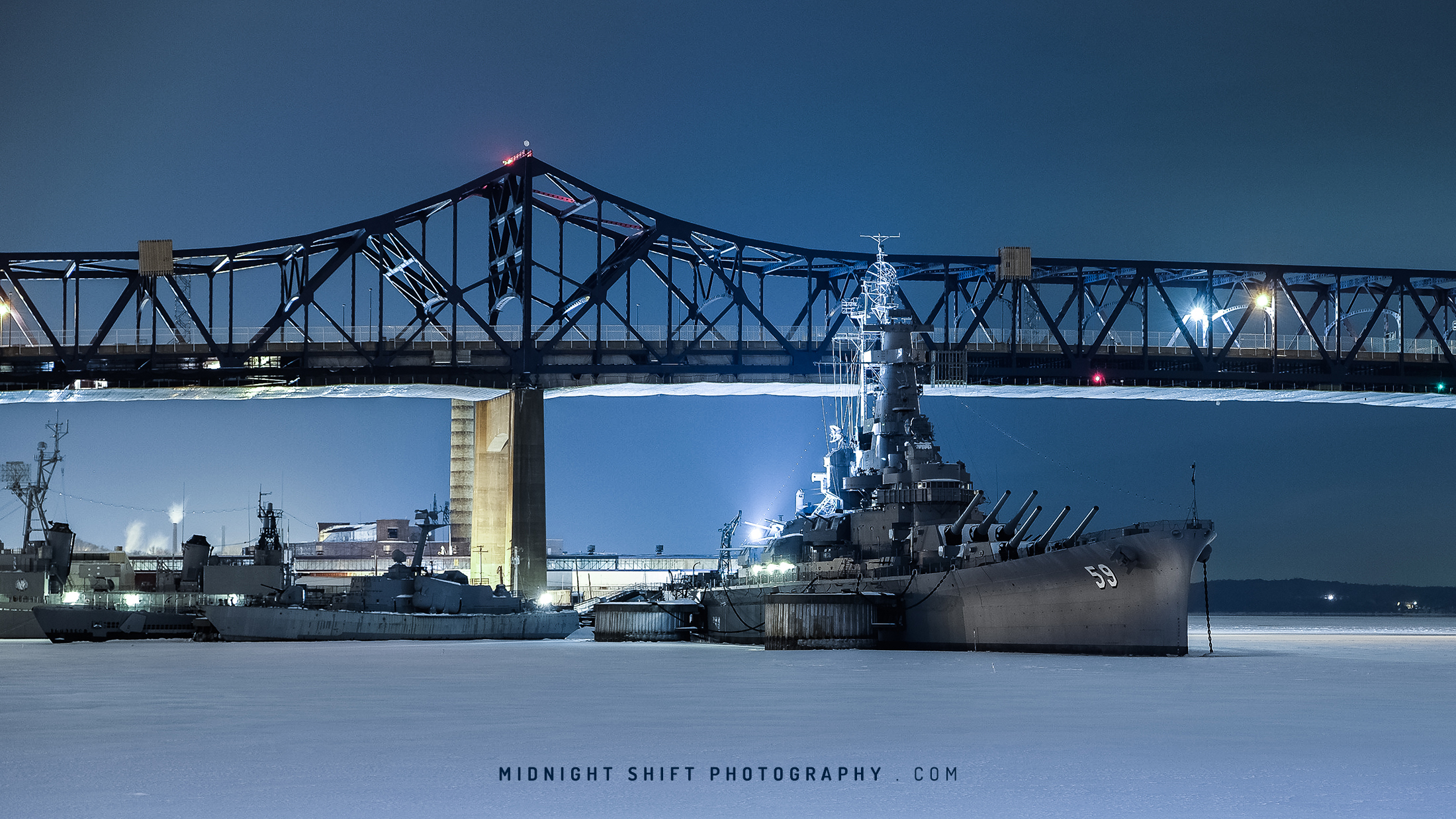 The USS Massachusetts sits stuck in a sheet of ice at Battleship Cove, in Fall River, Massachusetts.